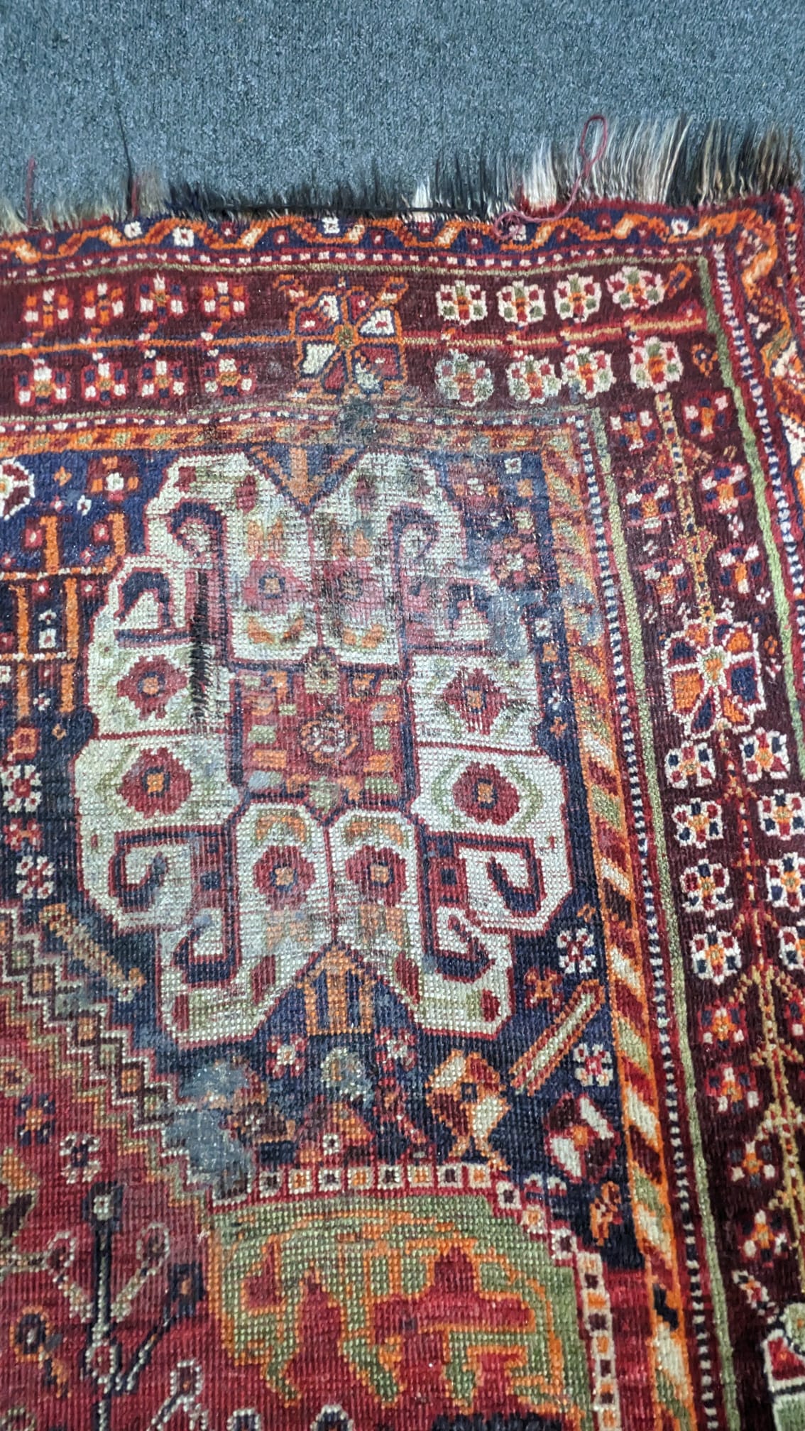 A Caucasian red ground carpet 260cm x 160cm.